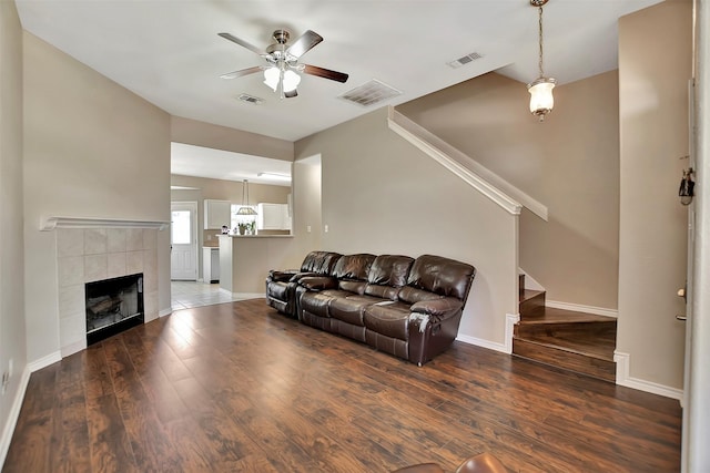 34606 Lake Side Dr, Brookshire, TX 77423 - living area with a ceiling fan, stairway, wood finished floors, baseboards, and a fireplace