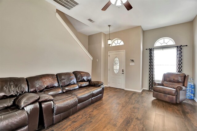 34606 Lake Side Dr, Brookshire, TX 77423 - living area featuring a ceiling fan, dark wood-style floors, baseboards, and a towering ceiling