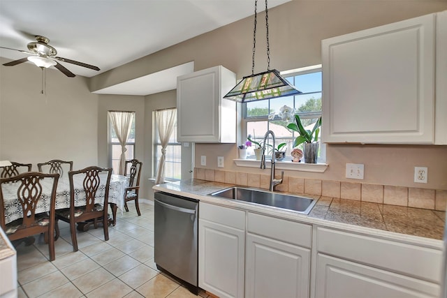 34606 Lake Side Dr, Brookshire, TX 77423 - kitchen with stainless steel dishwasher, a sink, tile counters, and a ceiling fan