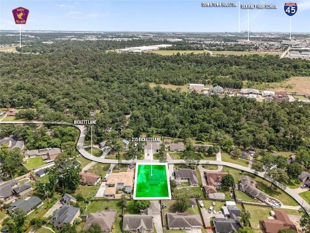 aerial view of property's location featuring a forest and property boundaries highlighted