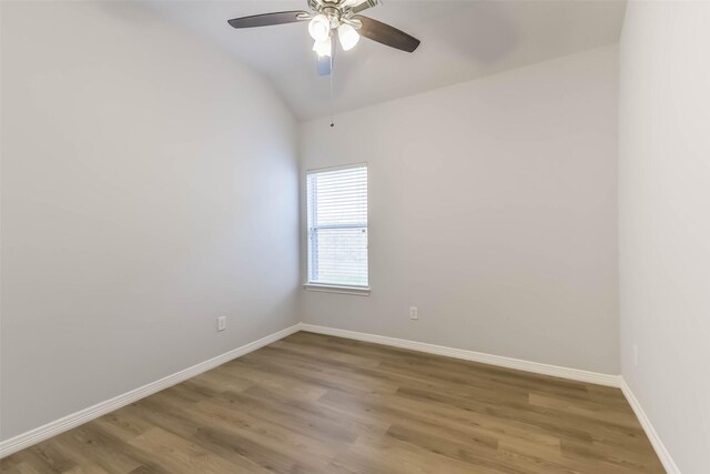 2212 Highland Crossing Dr, Conroe, TX 77304 - spare room featuring light wood-style flooring, ceiling fan, baseboards, and vaulted ceiling