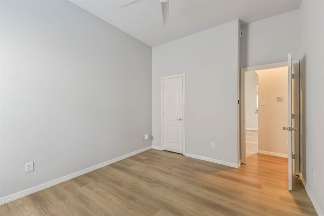2212 Highland Crossing Dr, Conroe, TX 77304 - unfurnished bedroom with light wood-style floors, baseboards, and ceiling fan