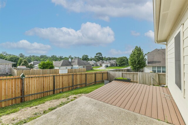 2212 Highland Crossing Dr, Conroe, TX 77304 - view of patio with a residential view, a deck, and a fenced backyard