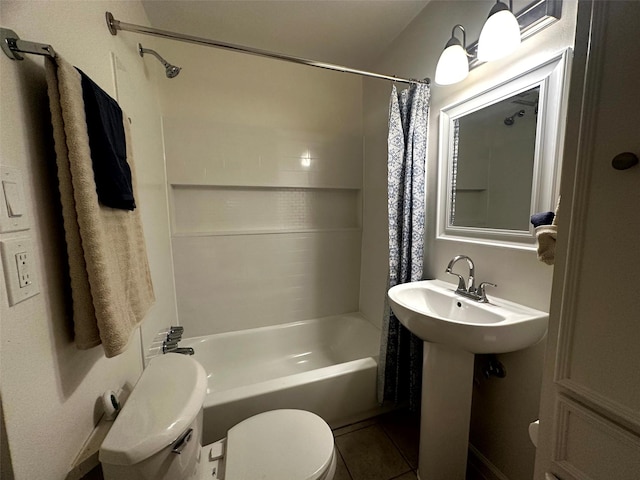 1023 W Snyder St, Alvin, TX 77511 - bathroom with toilet, shower / tub combo, and tile patterned floors
