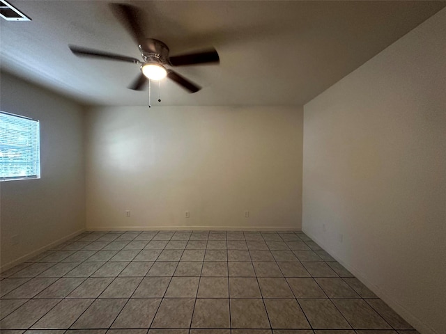1023 W Snyder St, Alvin, TX 77511 - empty room with a ceiling fan and light tile patterned floors