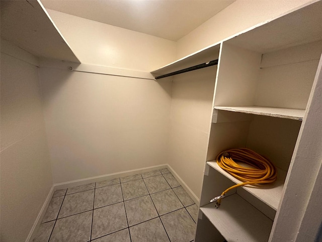 1023 W Snyder St, Alvin, TX 77511 - walk in closet with light tile patterned flooring