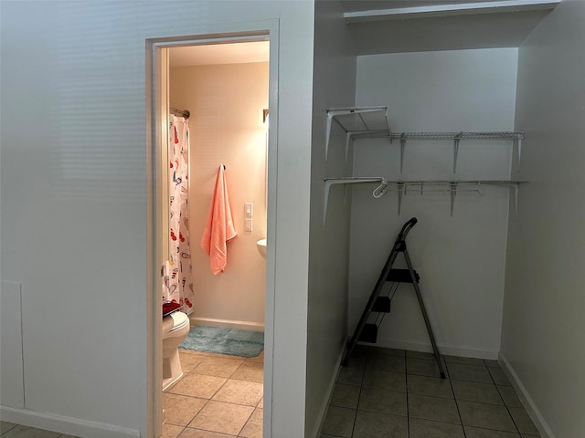 1023 W Snyder St, Alvin, TX 77511 - spacious closet featuring tile patterned floors