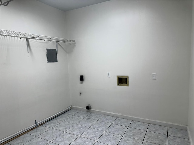 1023 W Snyder St, Alvin, TX 77511 - laundry room with hookup for a washing machine, light tile patterned floors, baseboards, and electric dryer hookup