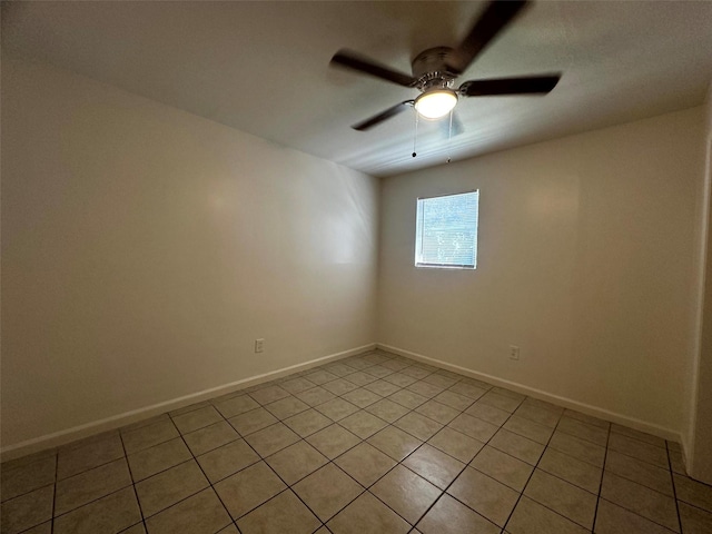 1023 W Snyder St, Alvin, TX 77511 - unfurnished room with light tile patterned floors, baseboards, and ceiling fan