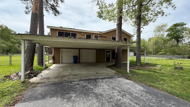 530 N Cattle Dr, Onalaska, TX 77360 - view of front facade featuring driveway and a carport