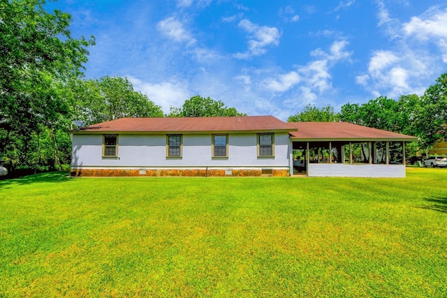9731 Hadden Rd, Baytown, TX 77521 - ranch-style house with a front yard
