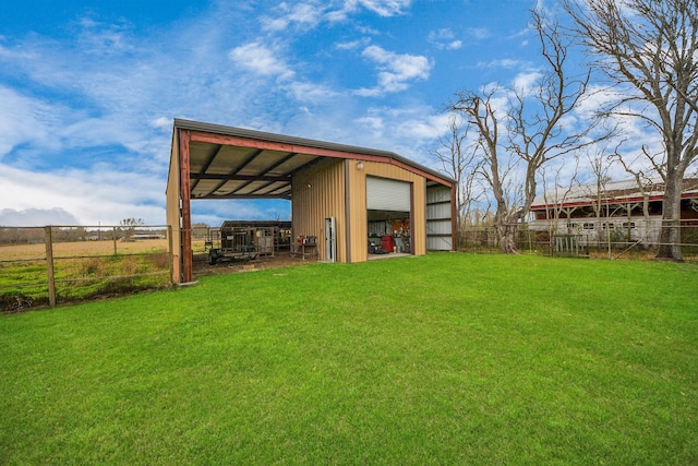 9731 Hadden Rd, Baytown, TX 77521 - rear view of house with a garage and an outbuilding