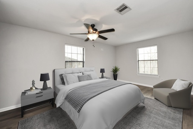 9731 Hadden Rd, Baytown, TX 77521 - bedroom featuring wood finished floors, baseboards, and a ceiling fan