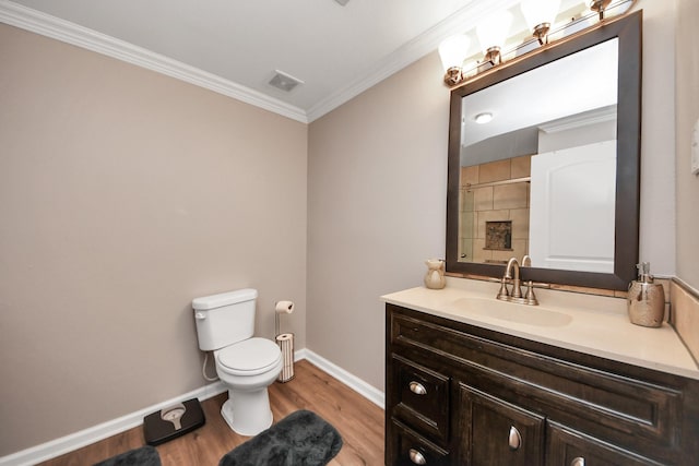 9731 Hadden Rd, Baytown, TX 77521 - full bath with wood finished floors, toilet, ornamental molding, baseboards, and vanity