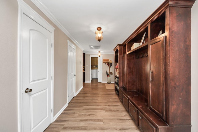 9731 Hadden Rd, Baytown, TX 77521 - mudroom with light wood-style flooring, baseboards, and ornamental molding