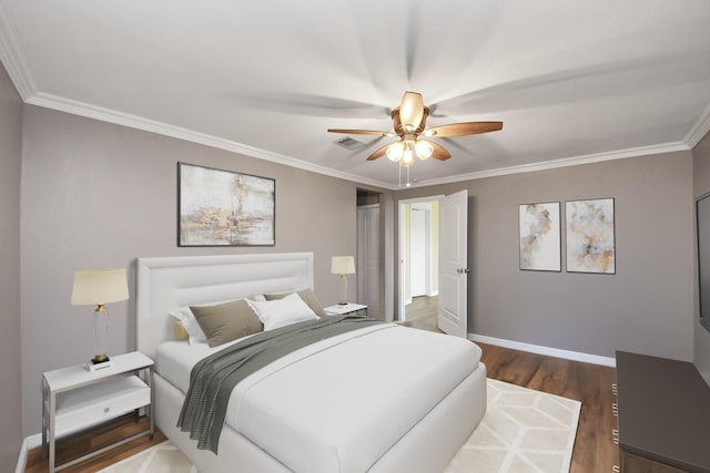 9731 Hadden Rd, Baytown, TX 77521 - bedroom featuring dark wood-style floors, crown molding, baseboards, and ceiling fan