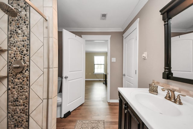 9731 Hadden Rd, Baytown, TX 77521 - bathroom featuring a shower stall, toilet, wood finished floors, crown molding, and vanity