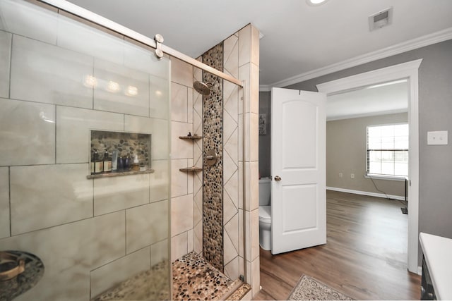 9731 Hadden Rd, Baytown, TX 77521 - full bath featuring crown molding, wood finished floors, a stall shower, toilet, and baseboards
