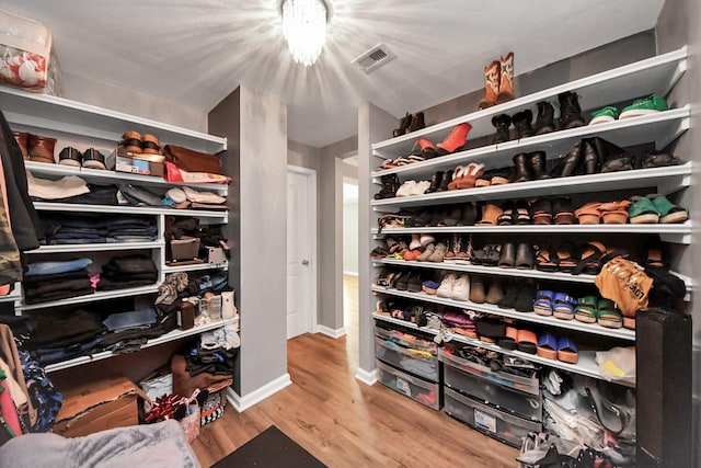 9731 Hadden Rd, Baytown, TX 77521 - spacious closet featuring wood finished floors