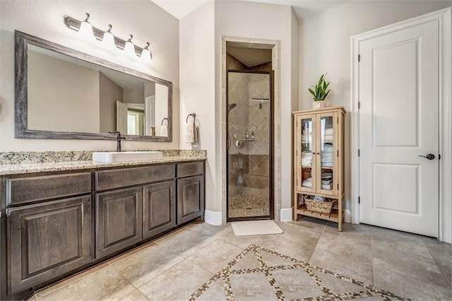 10210 Grape Creek Grove Ln, Cypress, TX 77433 - bathroom featuring a stall shower, vanity, baseboards, and tile patterned flooring