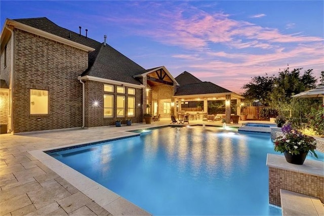 10210 Grape Creek Grove Ln, Cypress, TX 77433 - view of swimming pool with a patio area, a pool with connected hot tub, and an outdoor hangout area