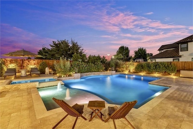10210 Grape Creek Grove Ln, Cypress, TX 77433 - pool at dusk featuring a patio area and a fenced backyard