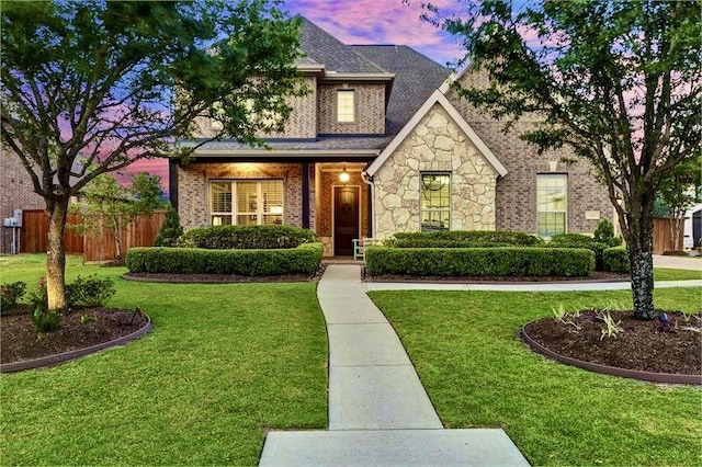 10210 Grape Creek Grove Ln, Cypress, TX 77433 - view of front of house featuring stone siding, brick siding, and a shingled roof