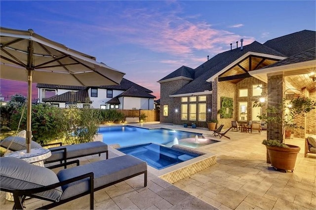 10210 Grape Creek Grove Ln, Cypress, TX 77433 - view of swimming pool featuring a patio and a pool with connected hot tub
