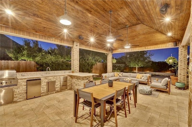 10210 Grape Creek Grove Ln, Cypress, TX 77433 - fenced backyard with a patio, outdoor lounge area, and a sink