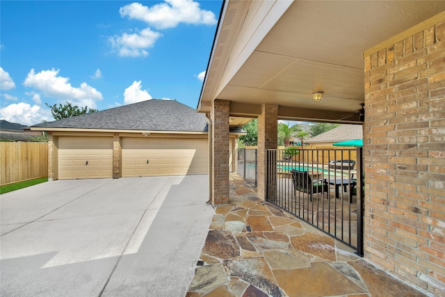 5714 Spring River Ln, Fulshear, TX 77441 - view of patio featuring driveway