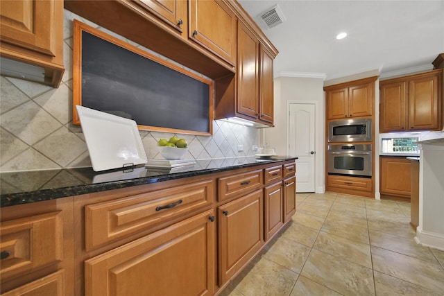 5714 Spring River Ln, Fulshear, TX 77441 - kitchen featuring stainless steel appliances, tasteful backsplash, brown cabinets, crown molding, and recessed lighting