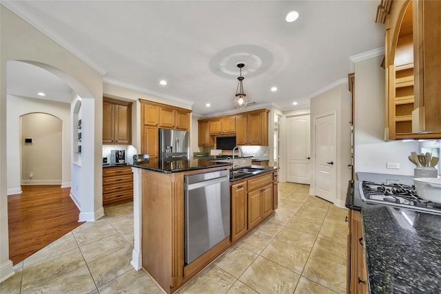 5714 Spring River Ln, Fulshear, TX 77441 - kitchen featuring a sink, appliances with stainless steel finishes, recessed lighting, ornamental molding, and brown cabinets