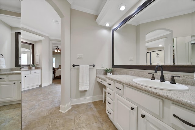 5714 Spring River Ln, Fulshear, TX 77441 - full bath with crown molding, ensuite bathroom, two vanities, baseboards, and tile patterned floors