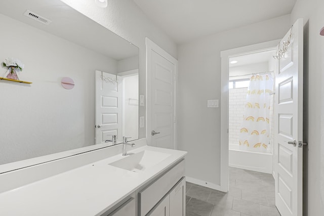 bathroom with vanity, tile patterned flooring, shower / bathtub combination with curtain, and baseboards
