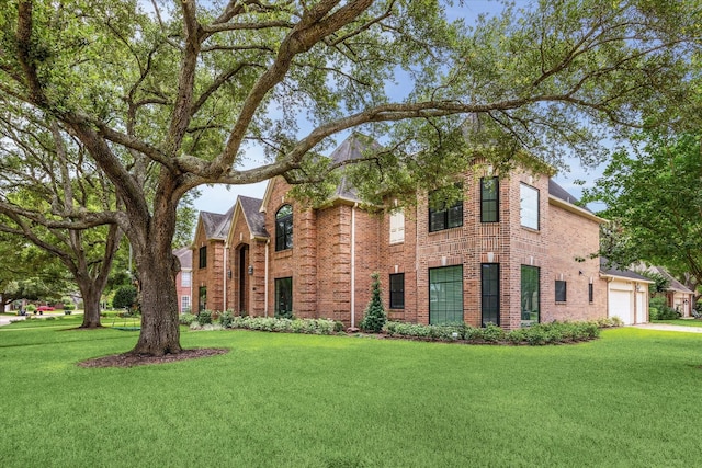 1602 Kelliwood Oaks Dr, Katy, TX 77450 - view of front facade featuring brick siding and a front lawn