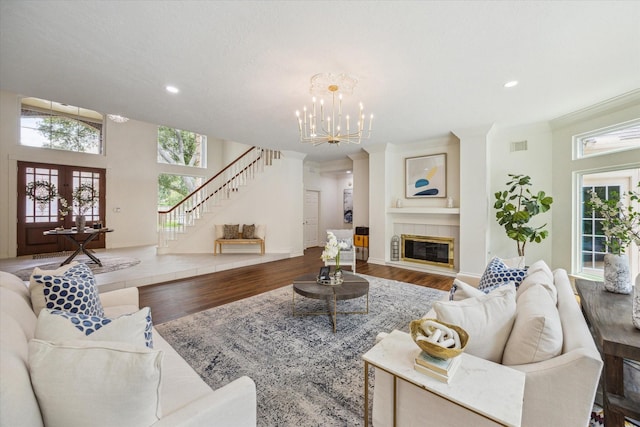 1602 Kelliwood Oaks Dr, Katy, TX 77450 - living room featuring stairs, plenty of natural light, wood finished floors, a chandelier, and recessed lighting