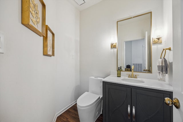 1602 Kelliwood Oaks Dr, Katy, TX 77450 - bathroom featuring vanity, toilet, wood finished floors, and baseboards