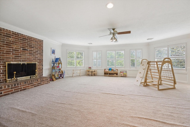 1602 Kelliwood Oaks Dr, Katy, TX 77450 - rec room with ornamental molding, ceiling fan, a brick fireplace, and carpet