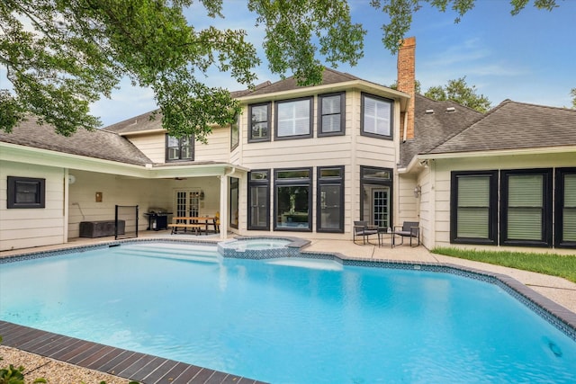 1602 Kelliwood Oaks Dr, Katy, TX 77450 - view of swimming pool featuring a patio area, a pool with connected hot tub, and a grill