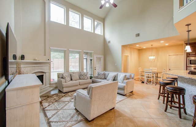 3539 Vasser Ridge Dr, Spring, TX 77388 - living room with high vaulted ceiling, ceiling fan, healthy amount of natural light, a premium fireplace, and light tile patterned floors