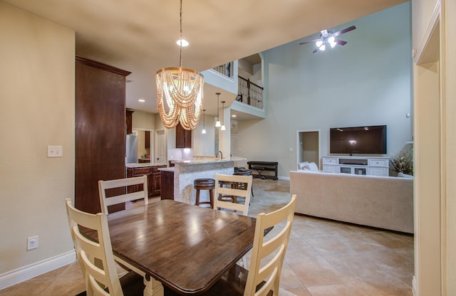 3539 Vasser Ridge Dr, Spring, TX 77388 - dining room featuring ceiling fan, a chandelier, baseboards, light tile patterned flooring, and recessed lighting