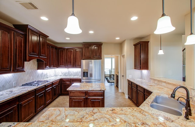3539 Vasser Ridge Dr, Spring, TX 77388 - kitchen with appliances with stainless steel finishes, a sink, tasteful backsplash, light tile patterned flooring, and recessed lighting