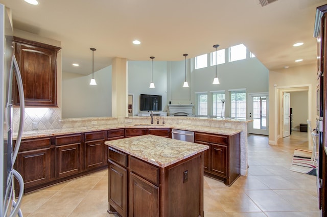 3539 Vasser Ridge Dr, Spring, TX 77388 - kitchen featuring stainless steel appliances, light tile patterned floors, open floor plan, a kitchen island, and recessed lighting
