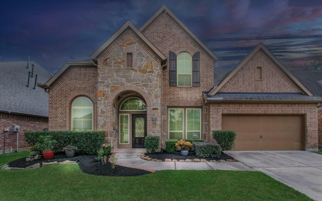 3539 Vasser Ridge Dr, Spring, TX 77388 - view of front of house with brick siding, concrete driveway, an attached garage, stone siding, and a front lawn
