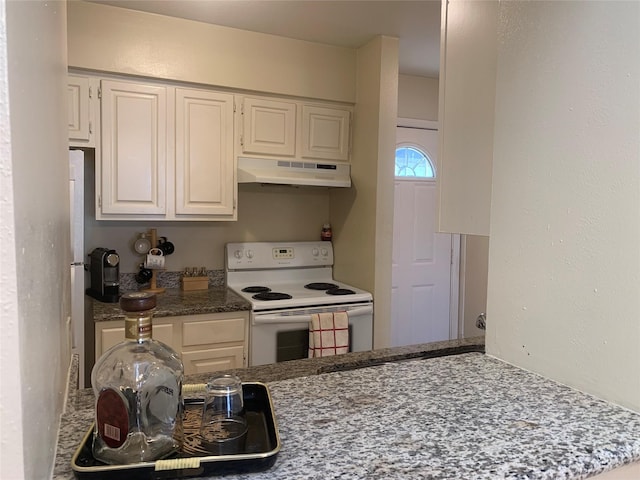 10075 Westpark Dr Unit 43, Houston, TX 77042 - kitchen featuring under cabinet range hood, electric stove, white cabinets, and dark stone countertops