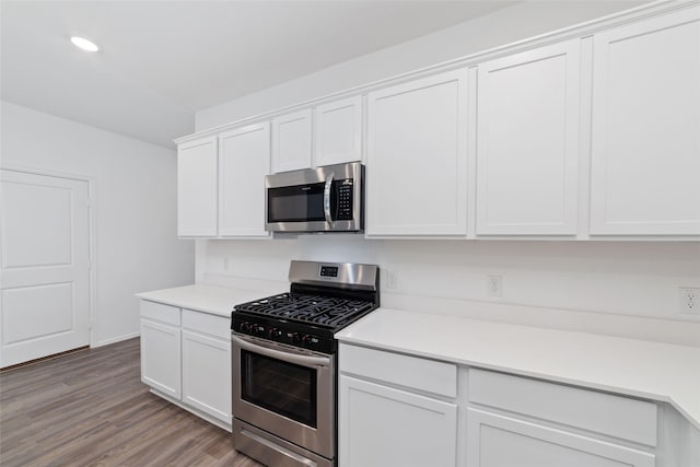 12206 English Mist Dr, Houston, TX 77044 - kitchen with stainless steel appliances, white cabinets, light wood-type flooring, light countertops, and recessed lighting
