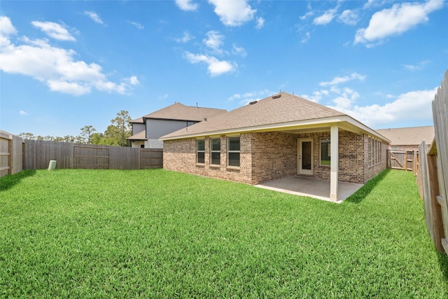 12206 English Mist Dr, Houston, TX 77044 - rear view of property featuring a patio, brick siding, and roof with shingles