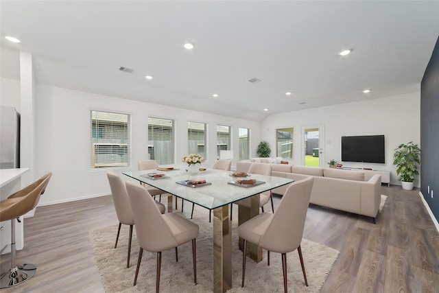 12206 English Mist Dr, Houston, TX 77044 - dining space with wood finished floors, baseboards, and recessed lighting