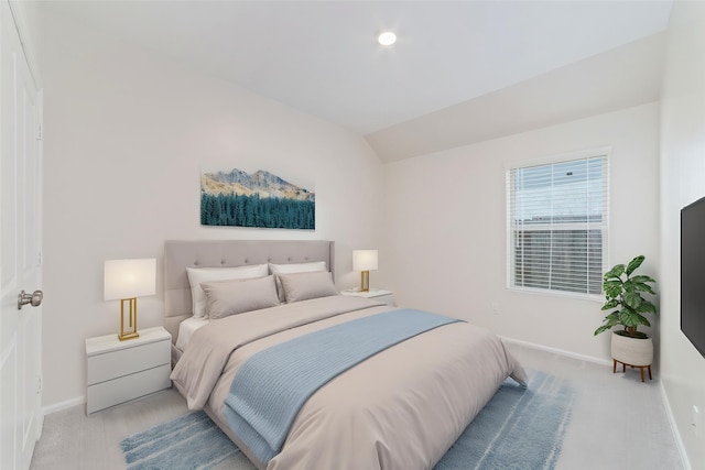 12206 English Mist Dr, Houston, TX 77044 - bedroom featuring baseboards, light carpet, and vaulted ceiling