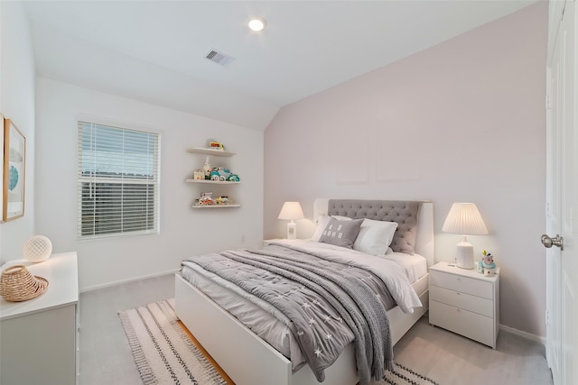 12206 English Mist Dr, Houston, TX 77044 - bedroom featuring light colored carpet, lofted ceiling, and baseboards